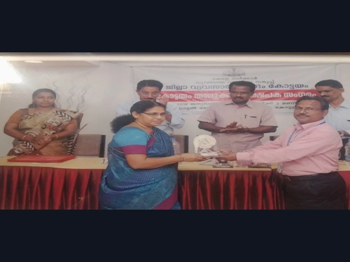 Receiving an award from the District Industries Centre, Kottayam